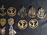 a lot of badges that are on a black table