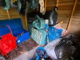 a room with a lot of bags and bags on the floor