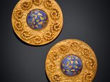 a pair of gold and blue enamel earrings