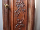 a wooden door that has a carved design on it