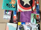 supplies laid out on a cardboard box for a child ' s craft project