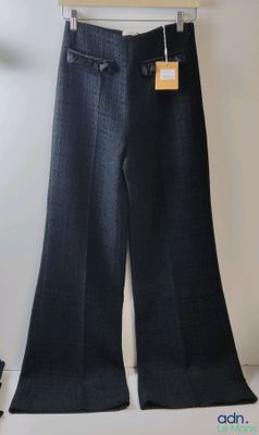 a picture of a pair of pants hanging on a hanger