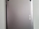 a close up of a silver laptop on a table