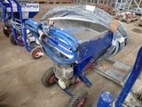 a blue machine that is sitting on the ground