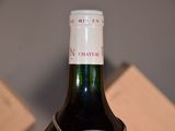 a bottle of wine that is sitting on a table
