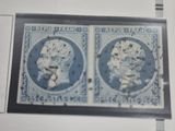 an image of two blue and white stamps on a piece of paper