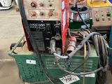 a machine that is sitting on a cart in a warehouse