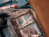 a blue case with tools in it sitting on a table