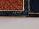 the inside of a wallet with a card holder attached to it