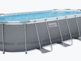 a large rectangular swimming pool with ladders on the side