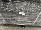 several rolls of wire wrapped in plastic on top of a table