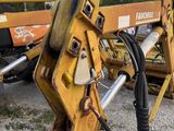 a close up of a fork on a construction vehicle
