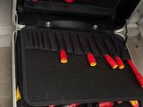 a suitcase with tools in it sitting on a table