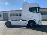 a picture of a white truck parked in front of a building