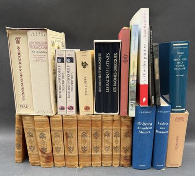 several books are stacked on top of each other on a table