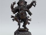 a bronze statue of the hindu god ganesh