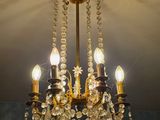 a chandelier hanging from the ceiling in a room