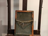 a picture of an easel with a chalk board on it