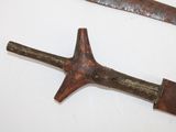 two old tools that are on a white surface