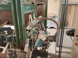 an image of a machine that is working on a piece of wood