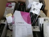 a cardboard box full of electronic devices and other items