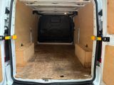 a white van with a black seat in the back of it
