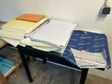 a table with a lot of papers on top of it