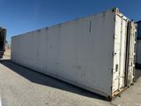 a large white container sitting in the middle of a parking lot