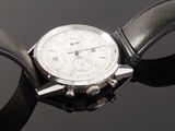 a close up of a wrist watch with a leather band