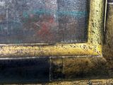 a close up of a picture of a painting on the wall