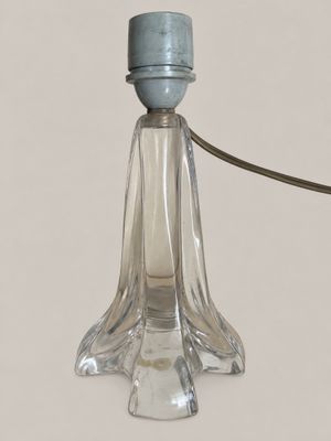 a glass lamp that has a cord attached to it