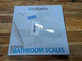 the box of the digital bathroom scales is on the table
