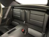 a black car with black leather seats in the back of it