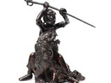 bronze statue of a man on a horse holding a spear