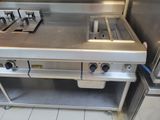 a stainless steel stove top with two burners on it