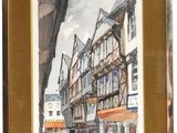 framed watercolor painting of a street scene in a european city