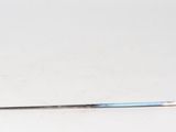 a metal pole with a blue handle on a white surface