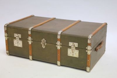three trunks sitting on top of each other on a white surface