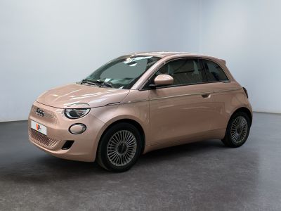 a pink smart car is parked in a white room