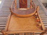 a wooden table with a wooden tray on top of it
