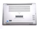 a close up of a laptop that is on a white surface