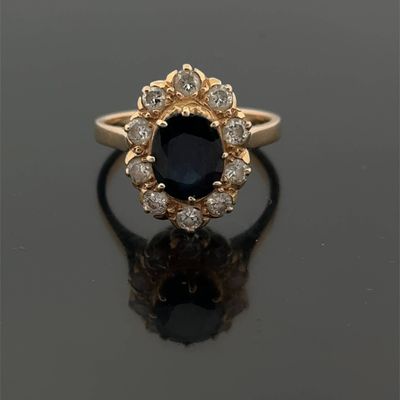 an oval sapphire and diamond cluster ring