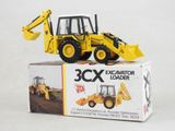 a yellow construction vehicle that is sitting on top of a box