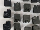 a lot of different types of electrical switches on a white surface
