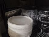 a plastic container sitting inside of a refrigerator filled with food