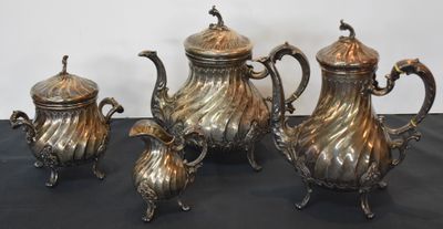 four piece silver plated tea set with matching teapots