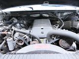 a picture of a car engine with its hood open
