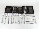 a lot of forks and spoons in a black box