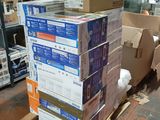 a stack of boxes sitting on a pallet in a warehouse