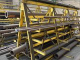 a large pile of pipes and pipes in a warehouse
